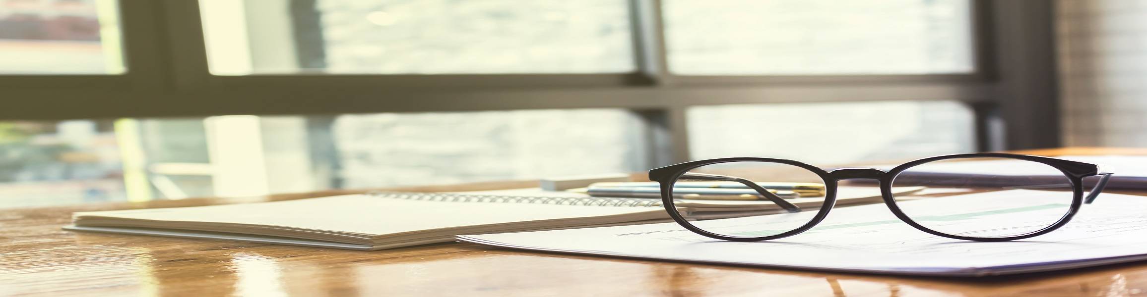 pair of glasses on a desk