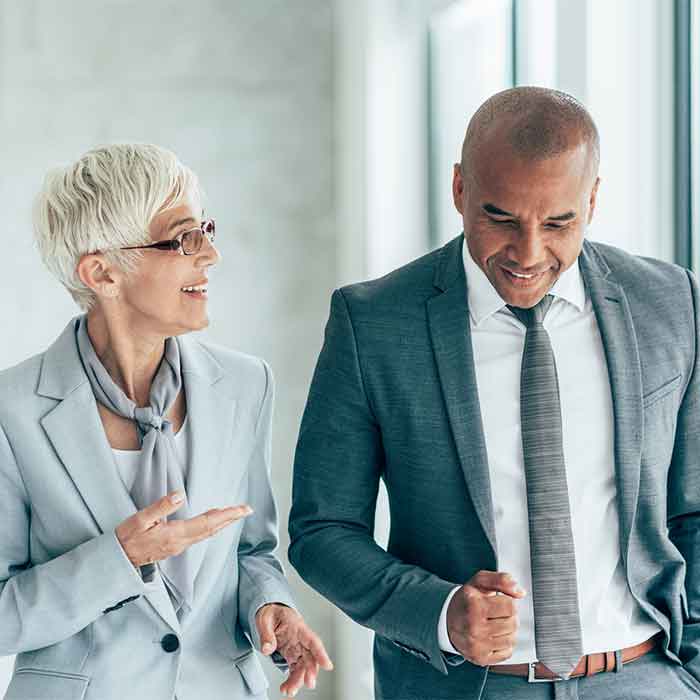 Two people talking at work