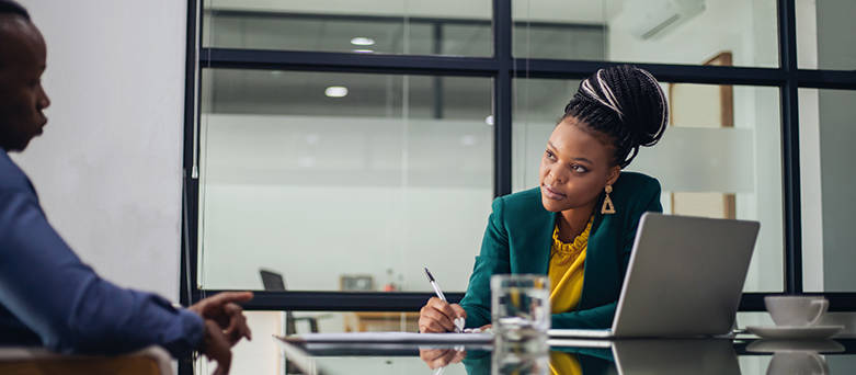 human resources manager task and responsibilities Two people having a discussion in the office